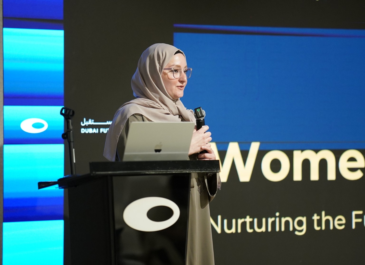 Israa Lulu speaking on stage